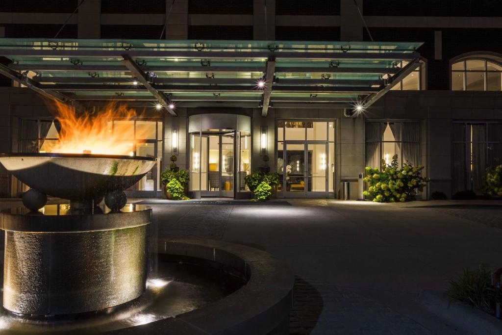 a fire fountain in front of a building at night at Hotel Blackhawk, Autograph Collection in Davenport