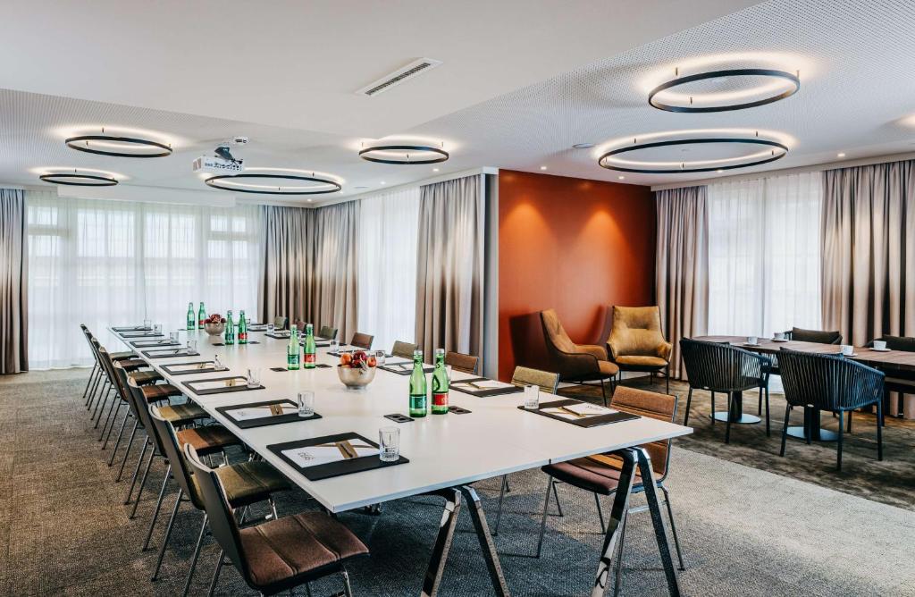 a conference room with a long table and chairs at Grand Tirolia Kitzbühel - Member of Hommage Luxury Hotels Collection in Kitzbühel