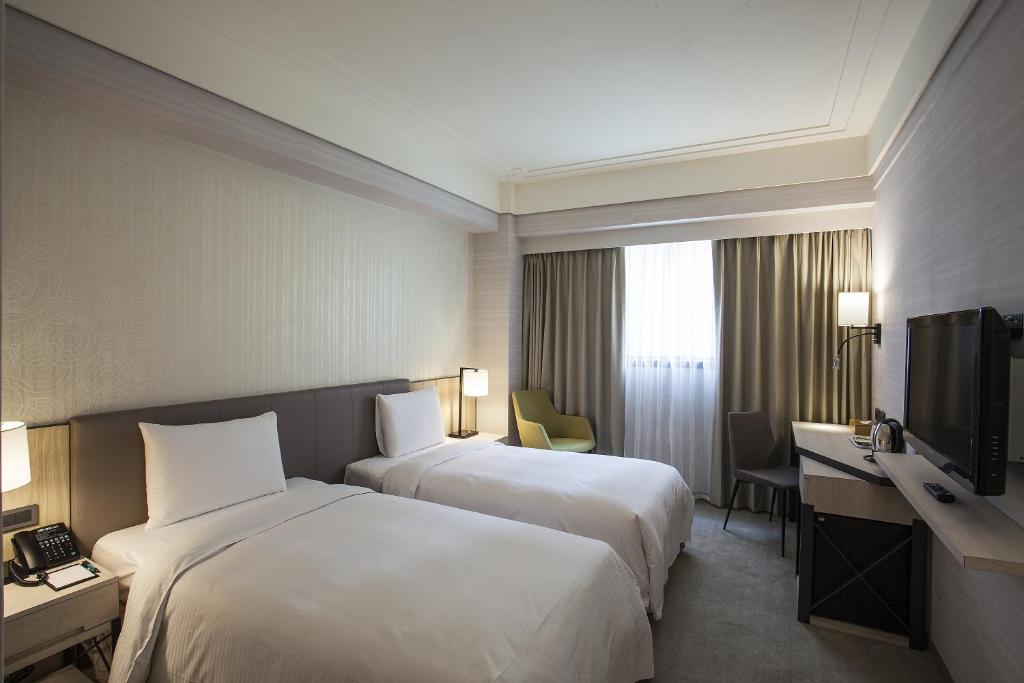 Postel nebo postele na pokoji v ubytování Citizen Hotel