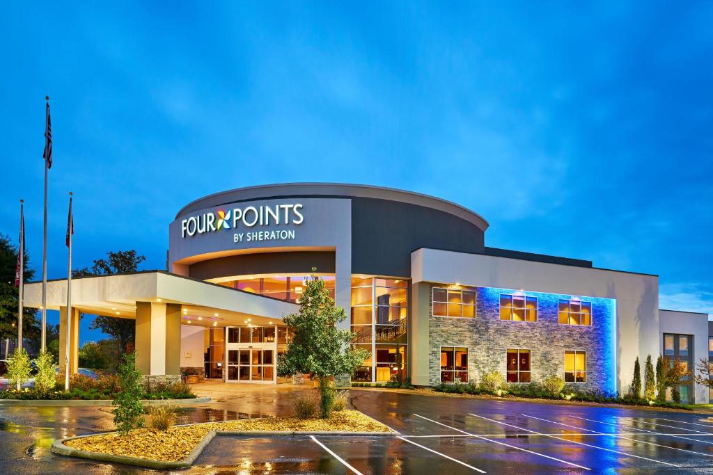 a building with a parking lot in front of it at Four Points by Sheraton Little Rock Midtown in Little Rock