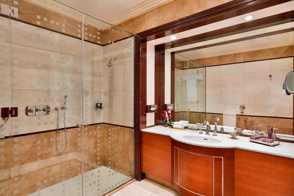 a bathroom with a shower and a sink at The Ritz-Carlton Jeddah in Jeddah