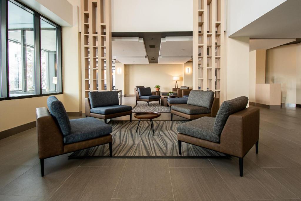 a waiting room with chairs and a table at Delta Hotels by Marriott Sherbrooke Conference Centre in Sherbrooke