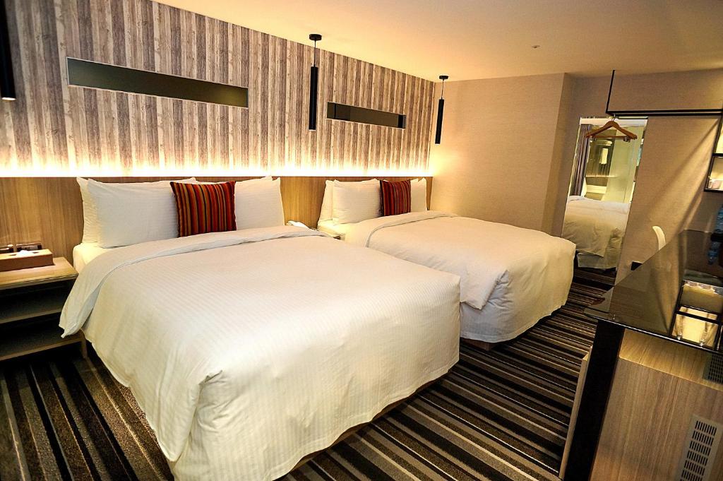 Postel nebo postele na pokoji v ubytování Via Hotel - Zhongxiao