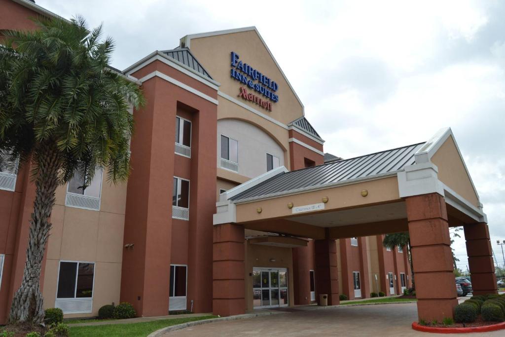 a hospital building with a palm tree in front of it at Fairfield Inn & Suites Houston Channelview in Channelview