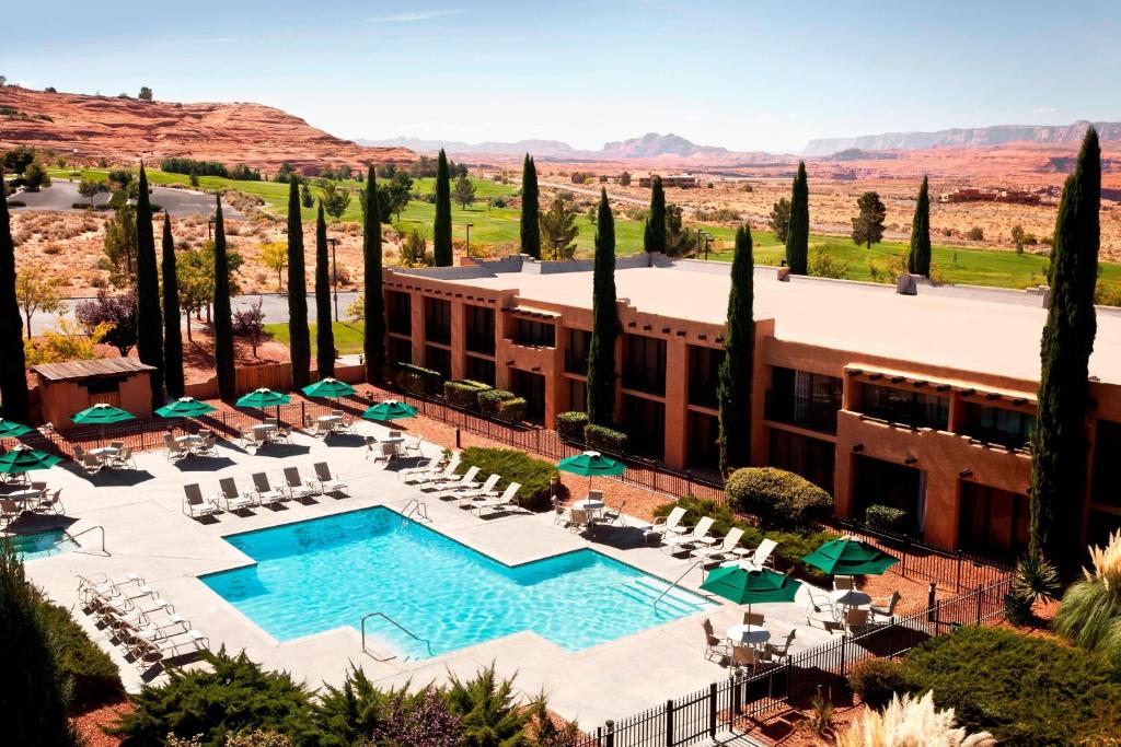 an aerial view of a hotel with a pool and trees at Courtyard Page at Lake Powell in Page