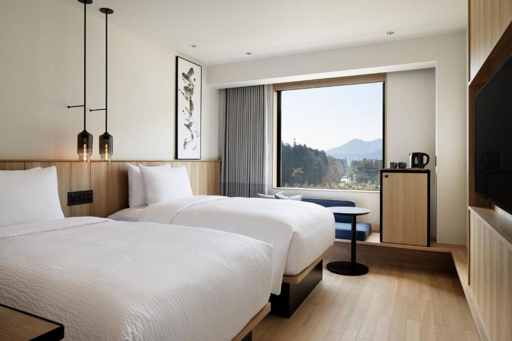 Postel nebo postele na pokoji v ubytování Fairfield by Marriott Tochigi Nikko