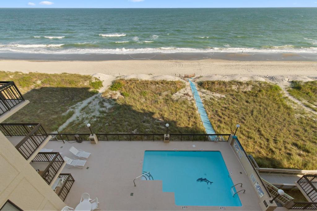 a view of the beach from the balcony of a beach house at Cozy & Charming Oceanfront Condo #803 @ Buena Vista in Myrtle Beach