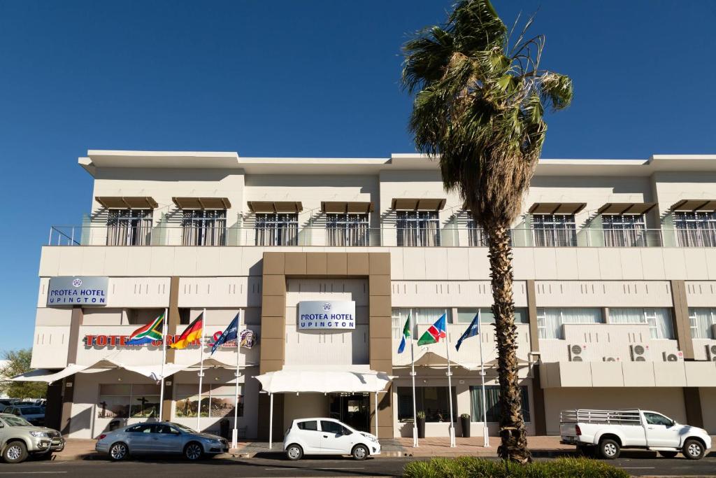 a building with cars parked in front of it at Protea Hotel by Marriott Upington in Upington