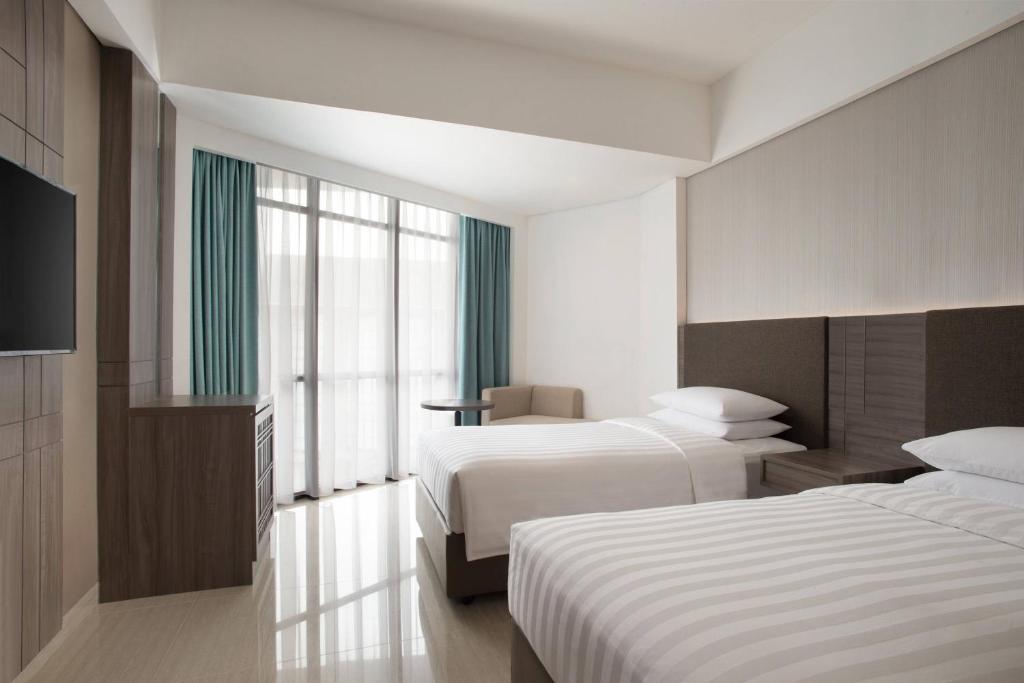 Postel nebo postele na pokoji v ubytování Fairfield by Marriott Belitung