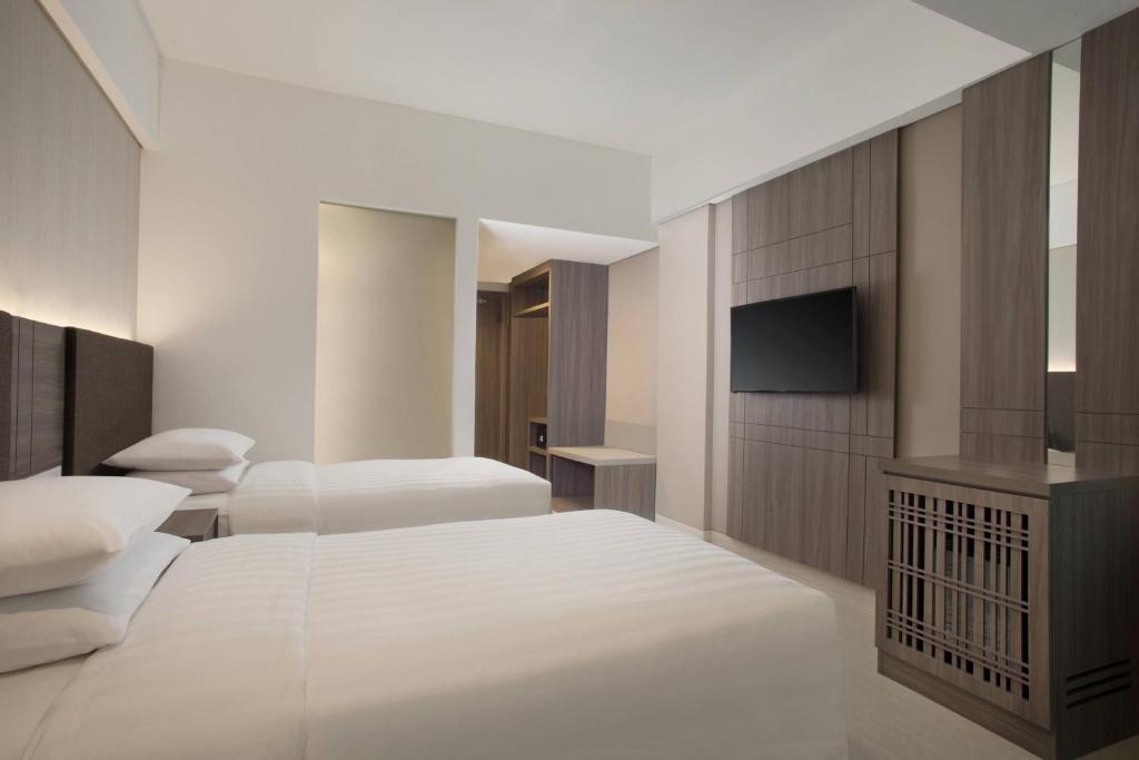 Postel nebo postele na pokoji v ubytování Fairfield by Marriott Belitung