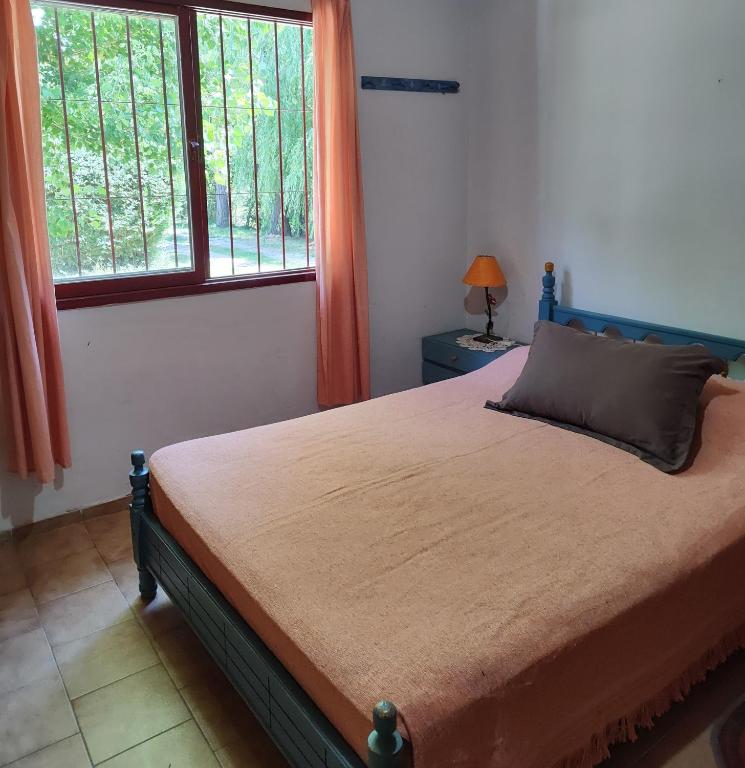 Postel nebo postele na pokoji v ubytování Cabañas Pequeño Paraíso