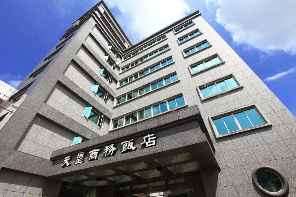 a building with asian writing on the side of it at 天璽商務飯店 Cullinan Hotel in Hualien City