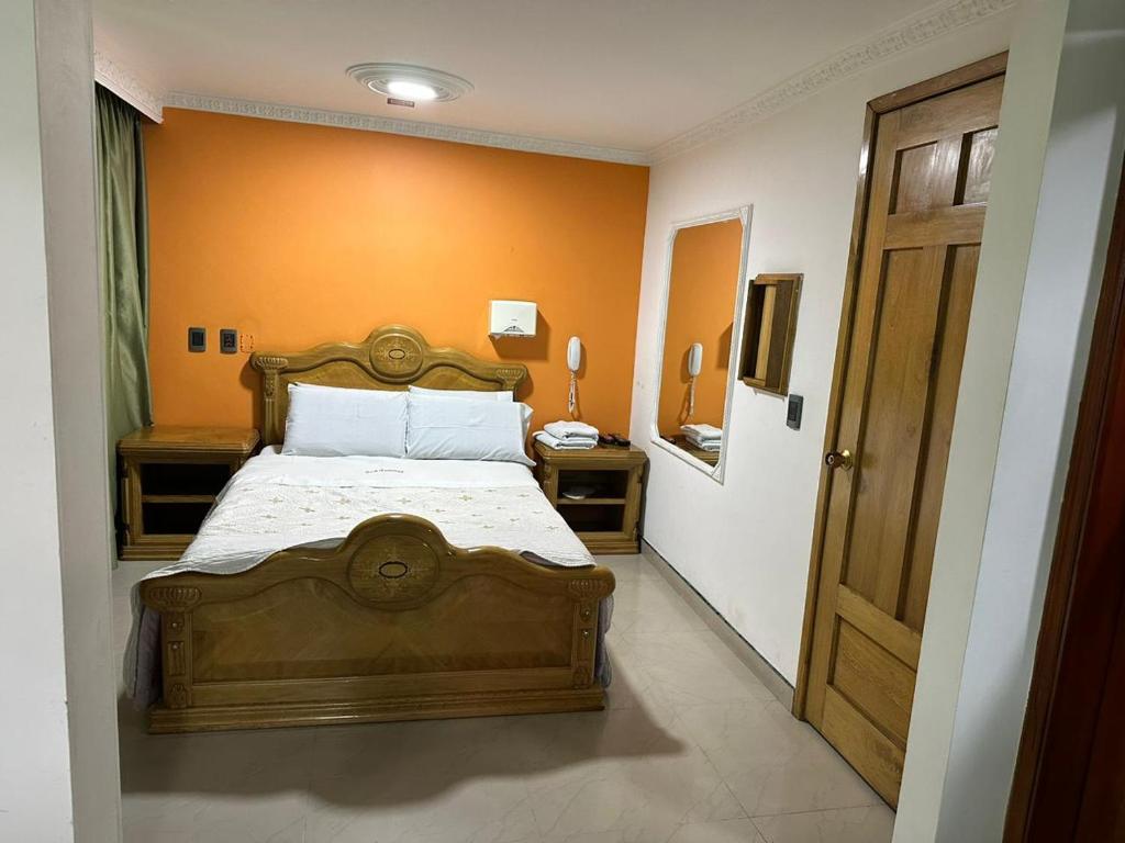 Postel nebo postele na pokoji v ubytování Hotel Bosque Chapinero