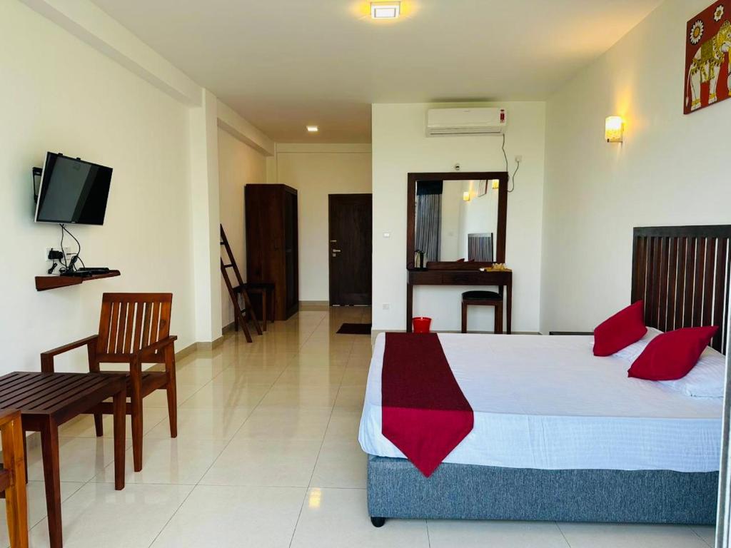 Postel nebo postele na pokoji v ubytování Kandy Hub Guest House