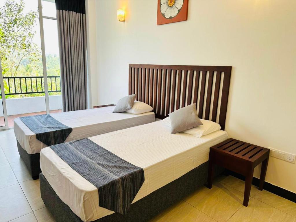 Postel nebo postele na pokoji v ubytování Kandy Hub Guest House