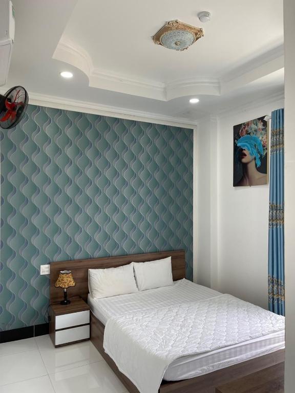 Postel nebo postele na pokoji v ubytování Kim Ngân Motel