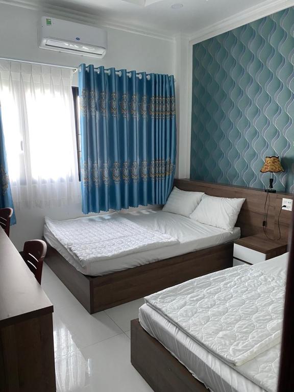 Postel nebo postele na pokoji v ubytování Kim Ngân Motel