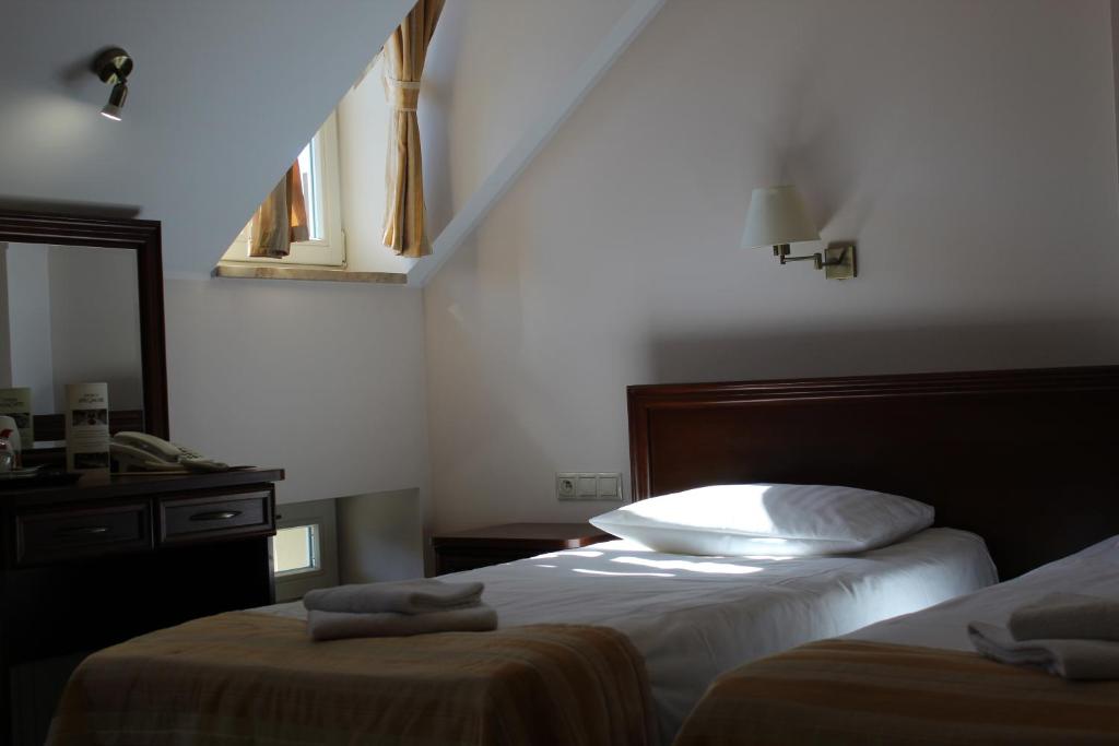 Posteľ alebo postele v izbe v ubytovaní Hotel Masovia