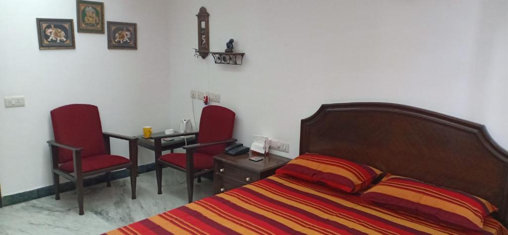 Postel nebo postele na pokoji v ubytování Blessings Noida Home stay