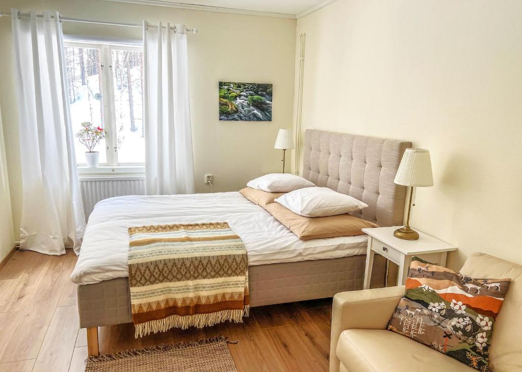 Postel nebo postele na pokoji v ubytování Fulufjällsgården