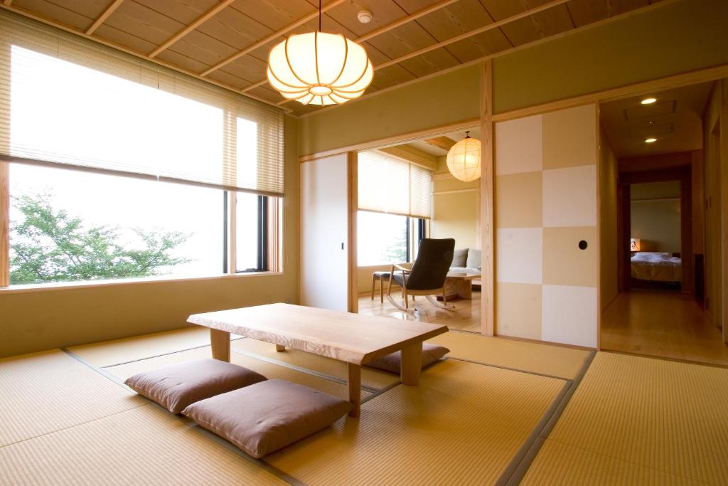 Postel nebo postele na pokoji v ubytování 山荘 風の杜 Sanso Kazenomori