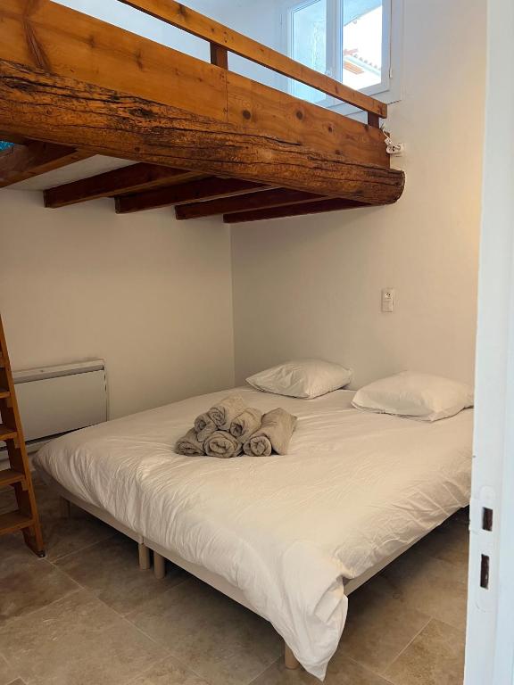 Posteľ alebo postele v izbe v ubytovaní Appartements à la ferme