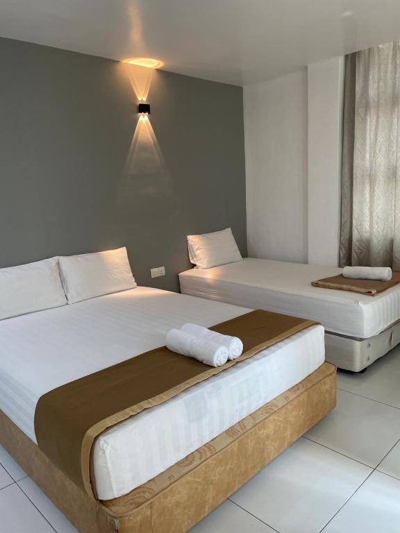 Postel nebo postele na pokoji v ubytování Hotel Lavender Inn