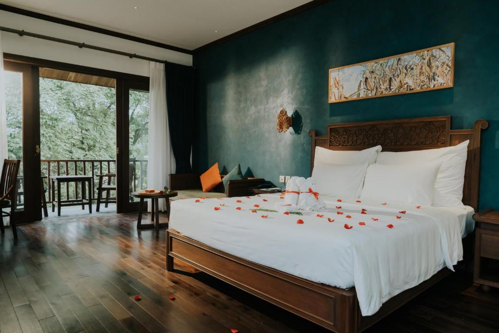 Postel nebo postele na pokoji v ubytování Amour Resort Bavi