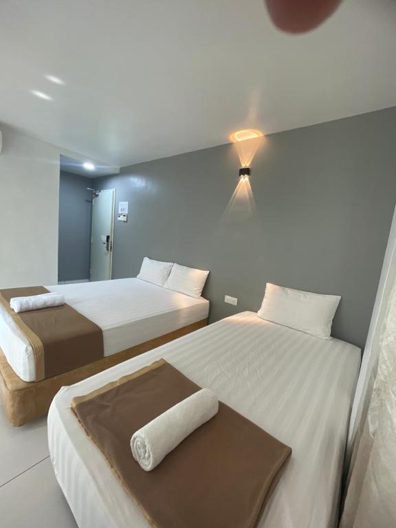 Postel nebo postele na pokoji v ubytování Hotel Lavender Inn