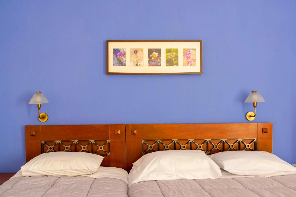 Posteľ alebo postele v izbe v ubytovaní Artemis Hotel