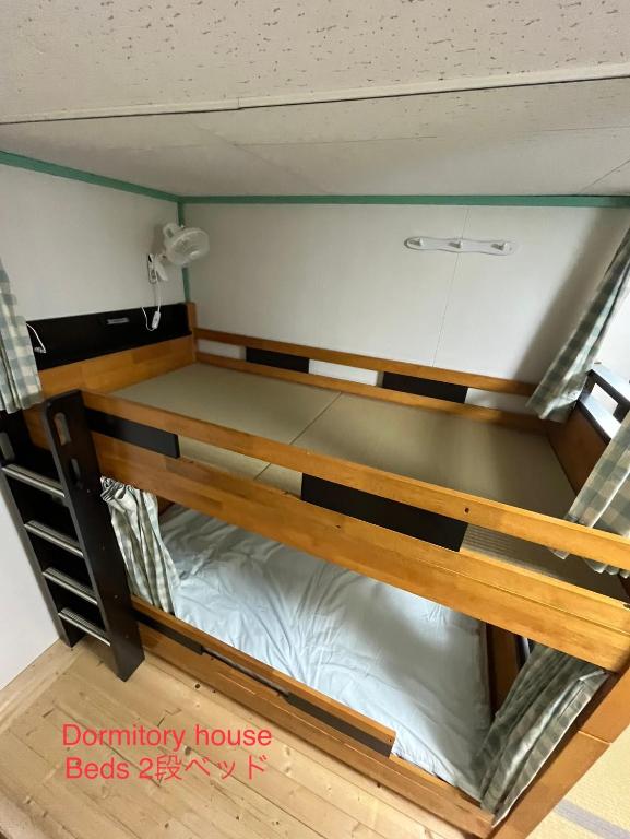 Postel nebo postele na pokoji v ubytování Dormitory Sandanya Guesthouse