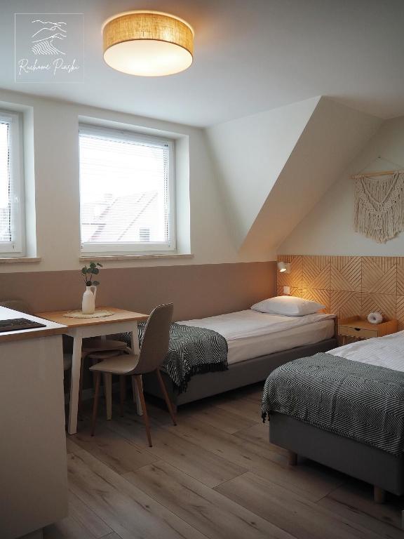 Postel nebo postele na pokoji v ubytování Ruchome Piaski