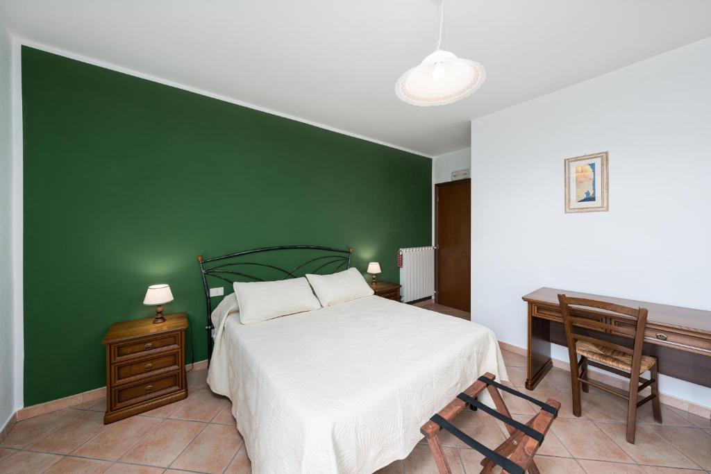 Postel nebo postele na pokoji v ubytování Agriturismo Daniela