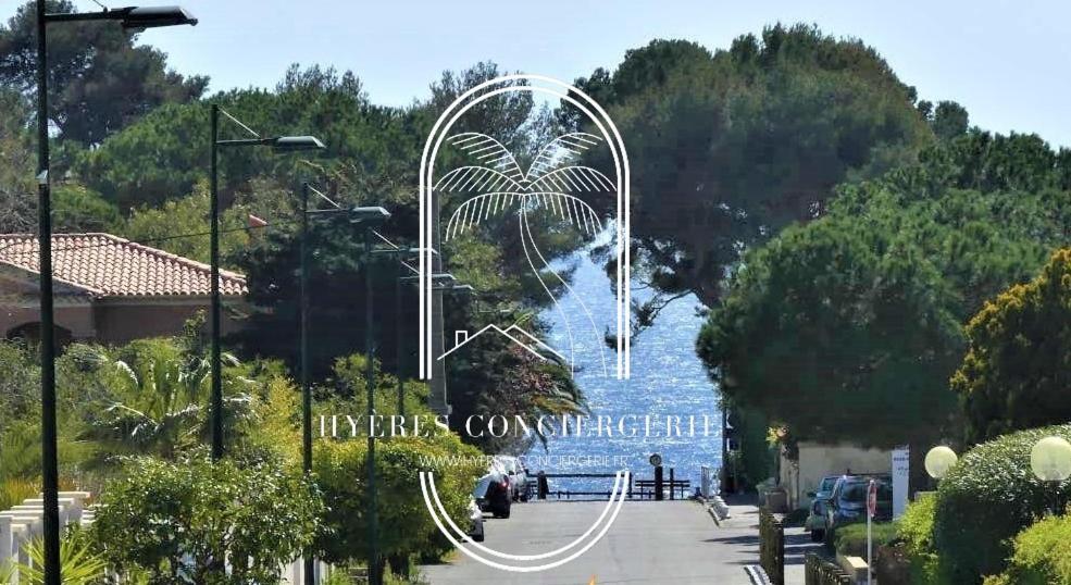 a large ferris wheel in the middle of a park at Au bout de la rue la Mer- T3 Jardin Piscine PARKING WIFI BY HC in Carqueiranne