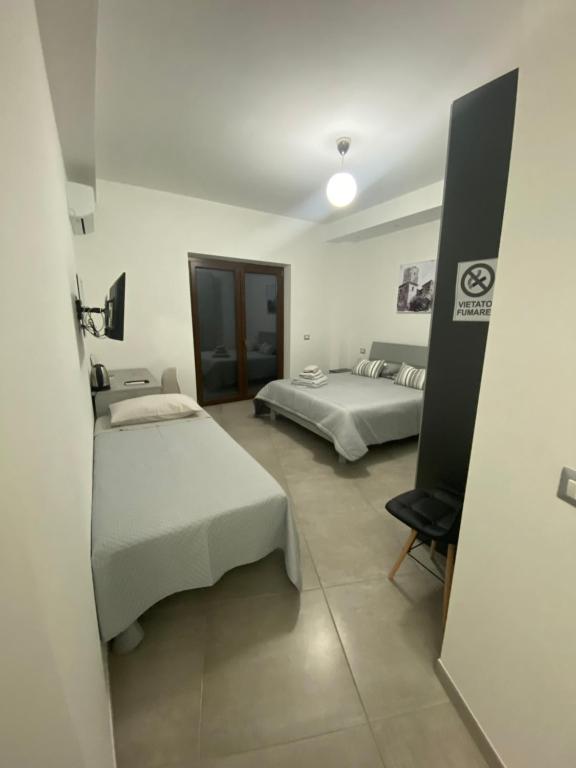 Posteľ alebo postele v izbe v ubytovaní A CASTA , come a casa tua