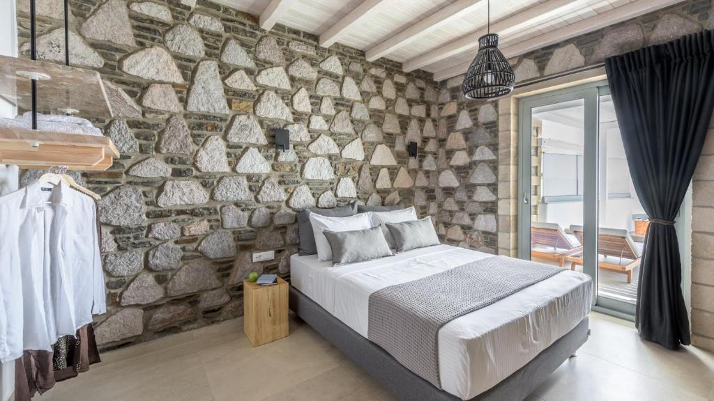 Postel nebo postele na pokoji v ubytování Thea Sunset Suites