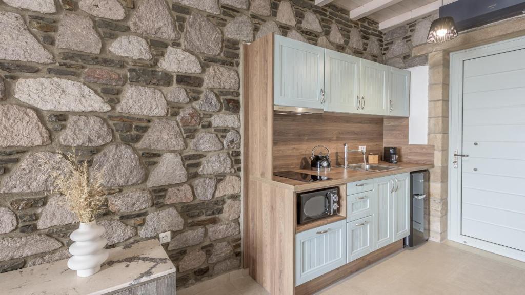 Kuchyň nebo kuchyňský kout v ubytování Thea Sunset Suites