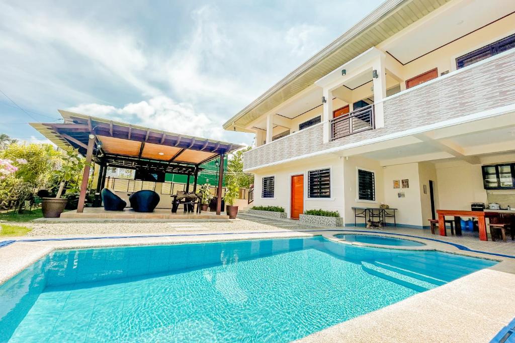 a swimming pool in front of a house at Cevy's Place at Liliw, Laguna in Liliw