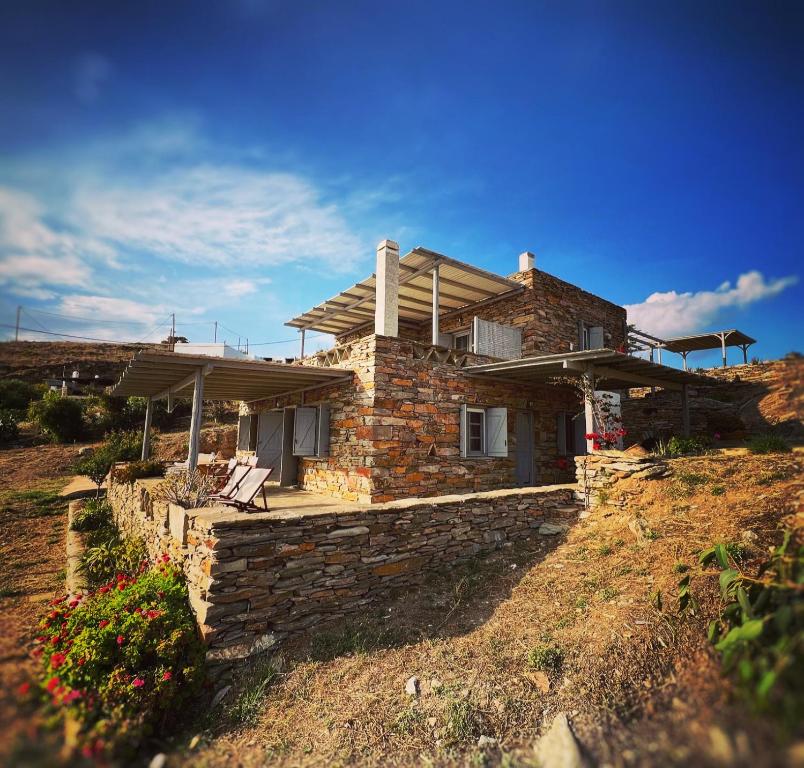 a stone house on top of a hill at The Traditional Stone Villa in Koundouros