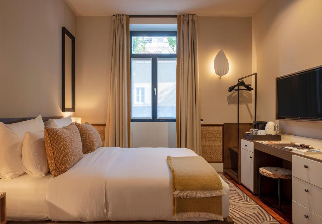 Postel nebo postele na pokoji v ubytování Casa da Marechal - Boutique Hotel by Oporto Collection - Adults Only