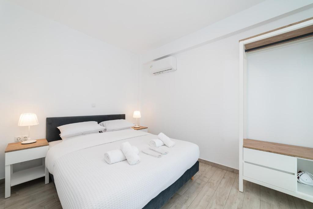 Postel nebo postele na pokoji v ubytování Perla Residential Complex