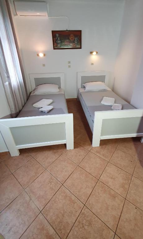Postel nebo postele na pokoji v ubytování ASTORIA lindos