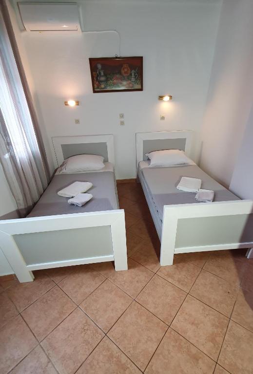 Postel nebo postele na pokoji v ubytování ASTORIA lindos