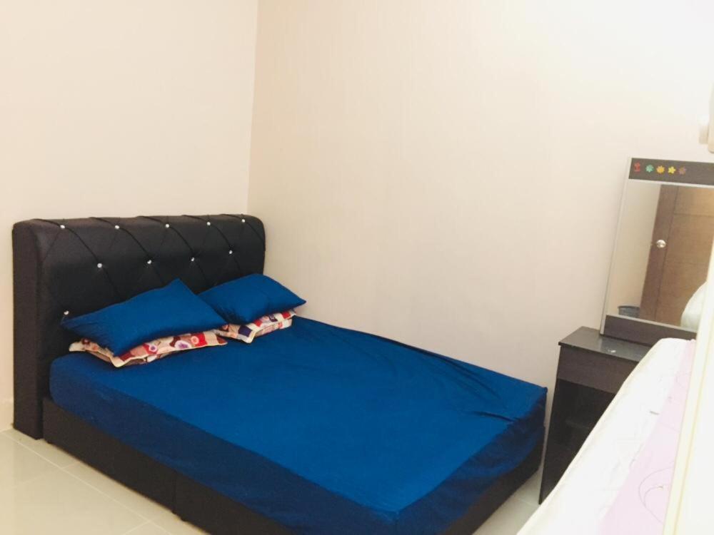 Krevet ili kreveti u jedinici u objektu Nurul Homestay Ipoh