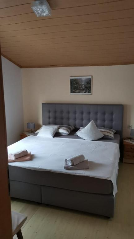 Łóżko lub łóżka w pokoju w obiekcie Apartman Tunja