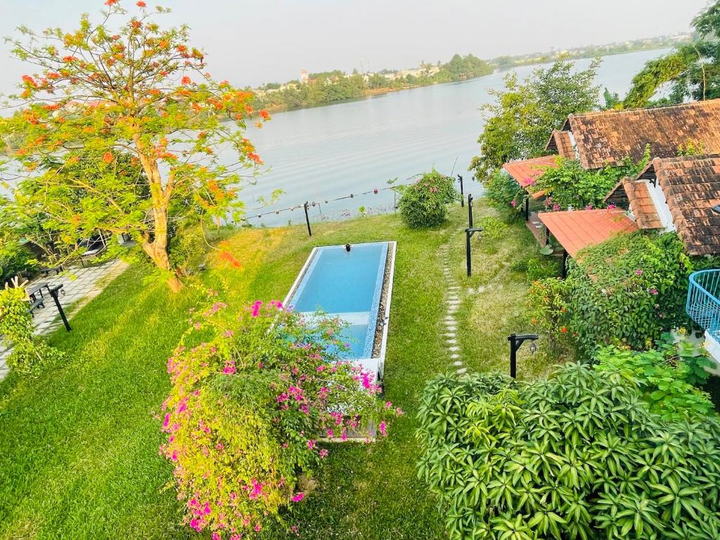 an aerial view of a house with a swimming pool at La Y Riverview in Hue