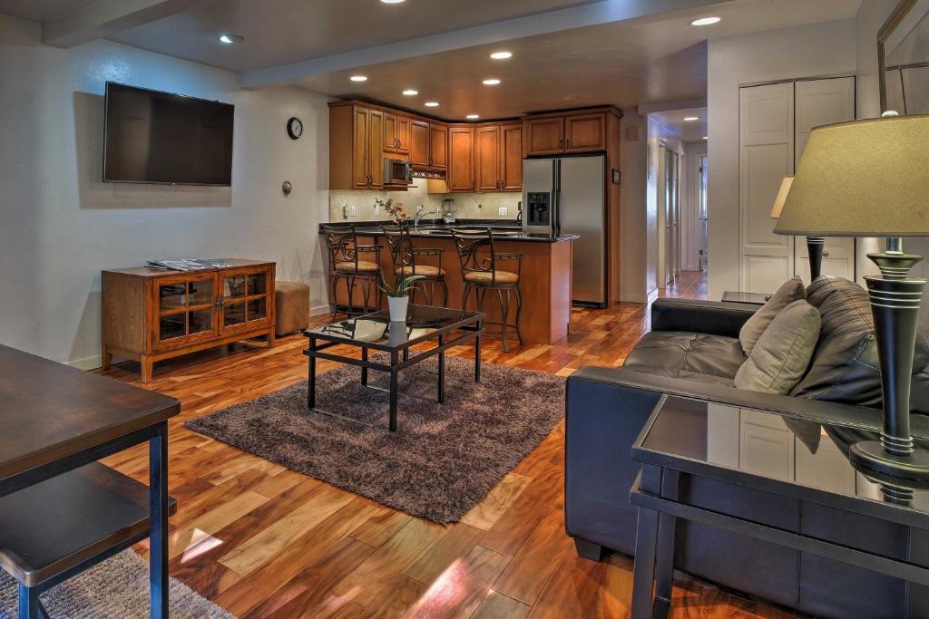 a living room with a couch and a kitchen at Charming Aspen Retreat - Bus to Ski Areas condo in Aspen