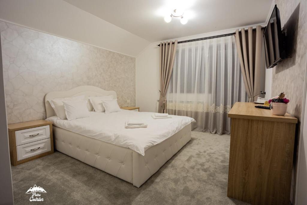 Letto o letti in una camera di Piatra Codrilor