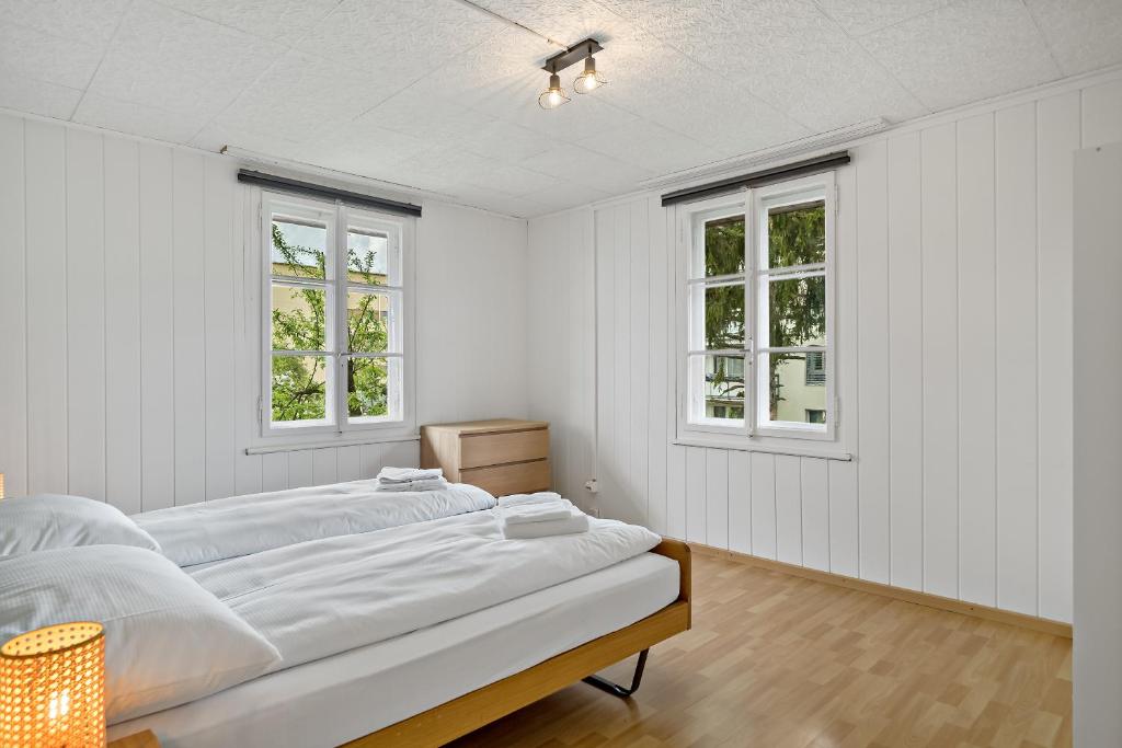 Postel nebo postele na pokoji v ubytování Erlen Rooms