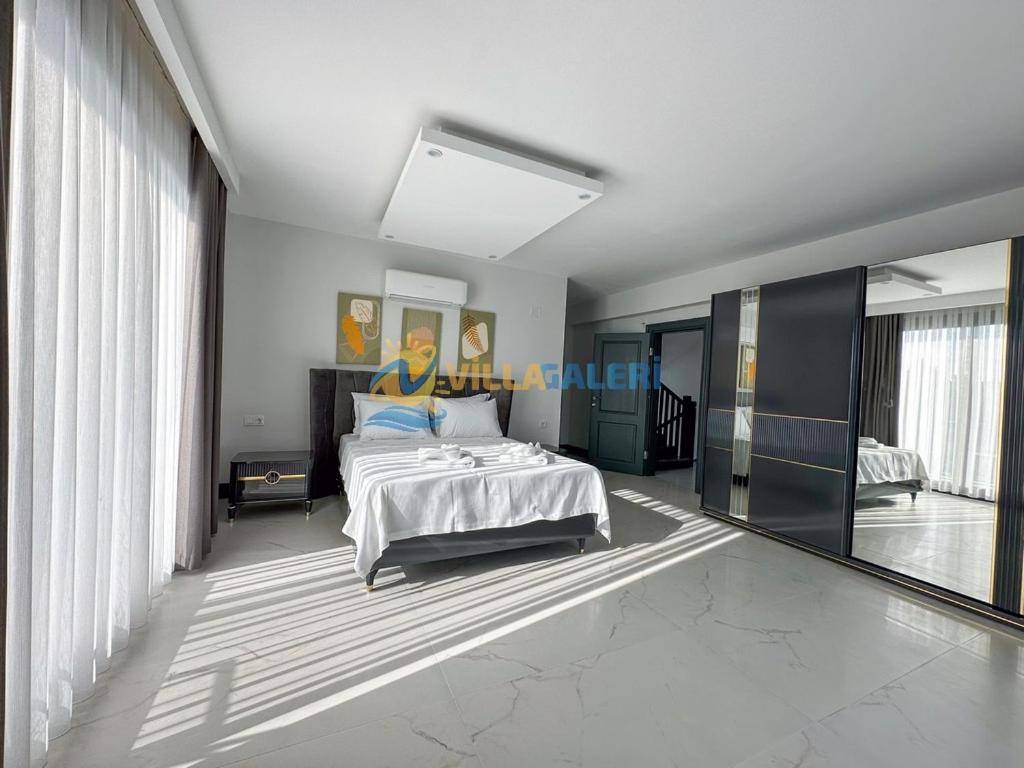 Postel nebo postele na pokoji v ubytování Galaxy Villas in Fethiye
